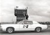 Nikki Phillips waving out of 72 Pontiac Grand Prix.jpg